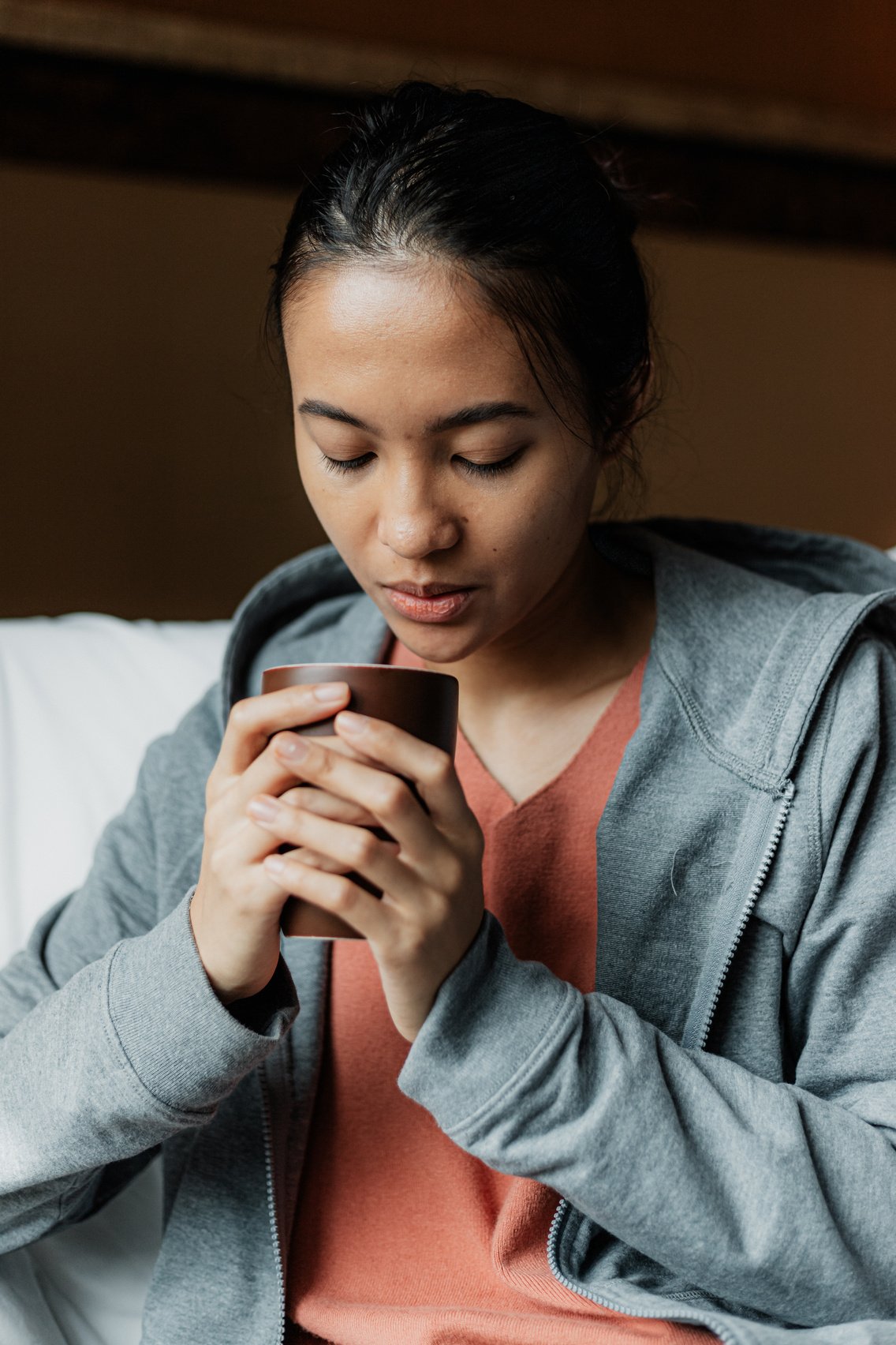 Woman Holding a Cup of Coffee